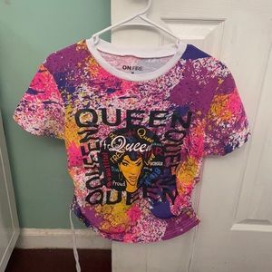 A slightly cropped colorful t-shirt.